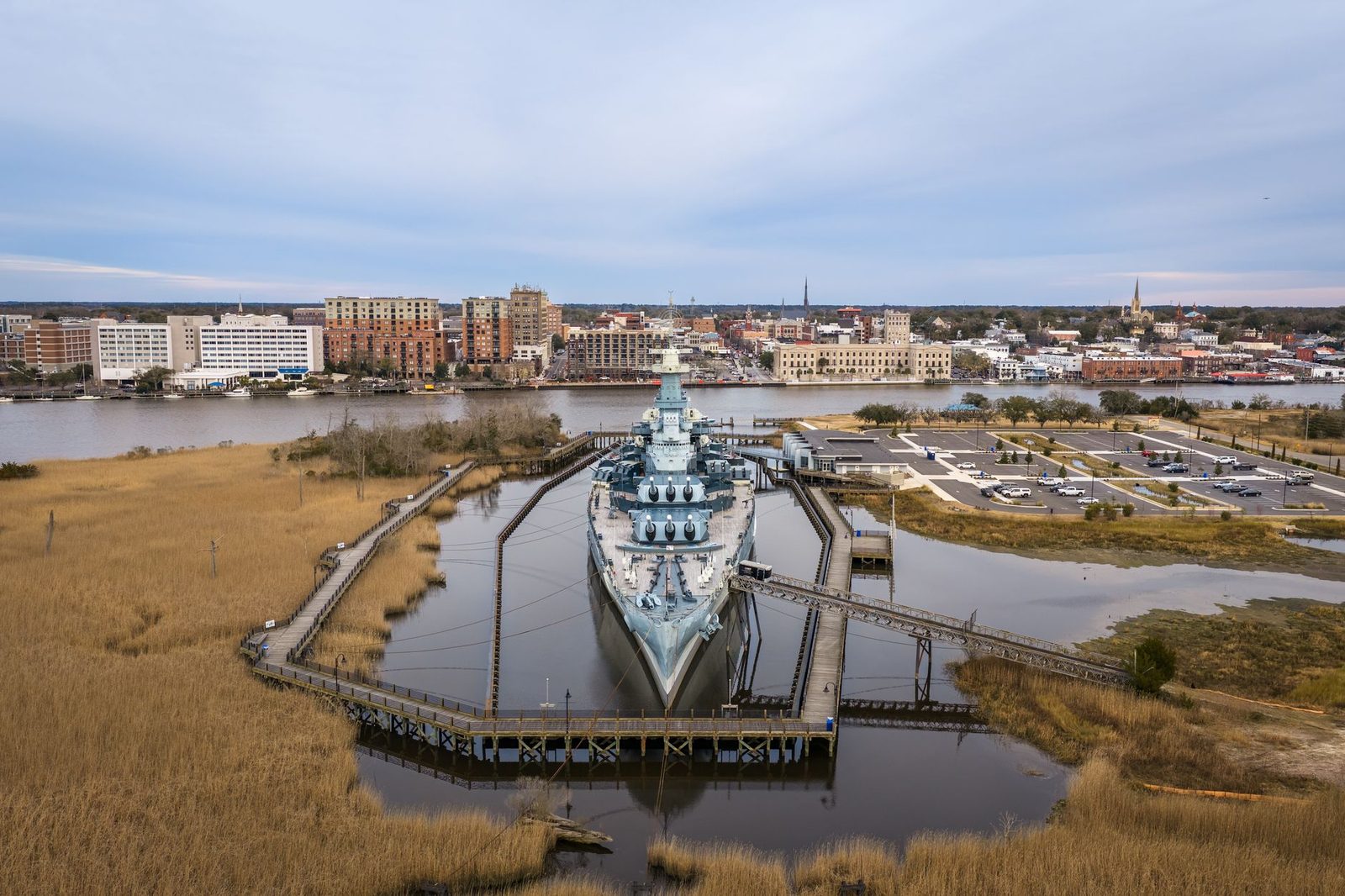 The Battleship North Carolina moored at Wilmington with the city behind it